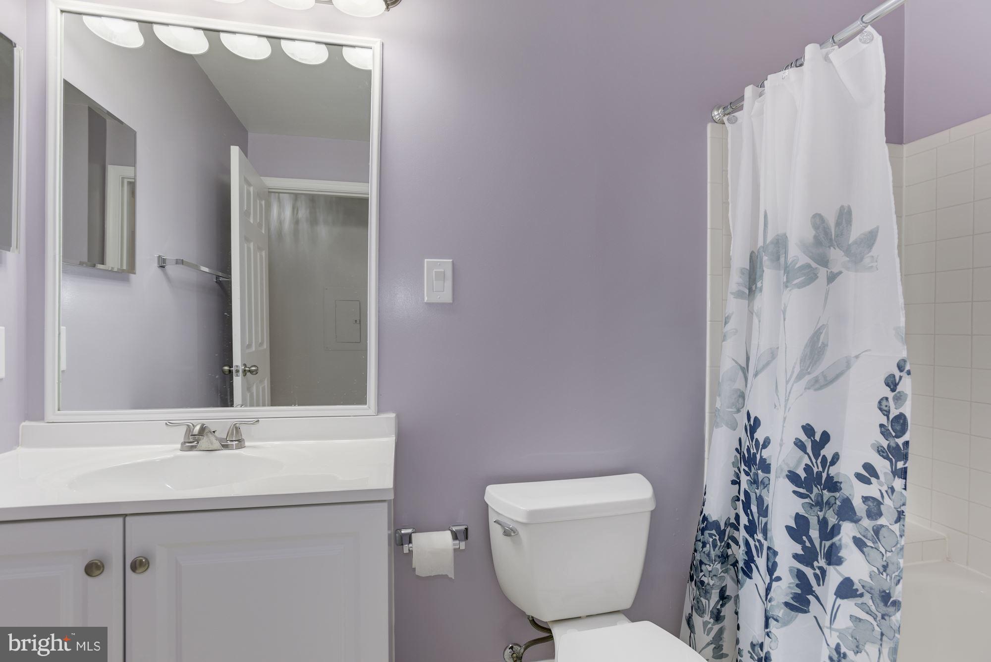 20579 Snowshoe Square, Unit 301 Ashburn, VA 20147 - Photo 22 of 30 a bathroom with a sink toilet and shower
