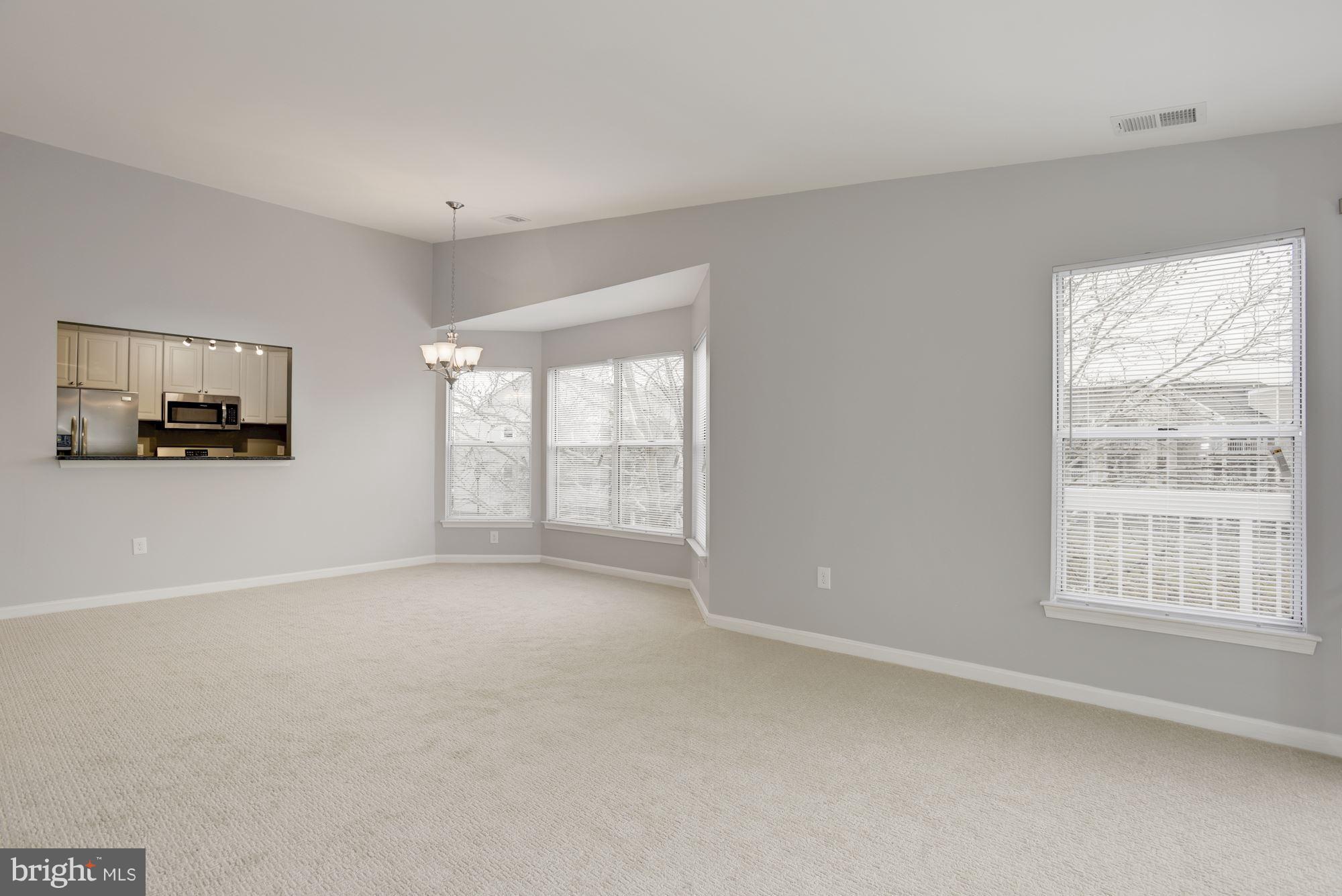 20579 Snowshoe Square, Unit 301 Ashburn, VA 20147 - Photo 4 of 30 a view of an empty room with a window