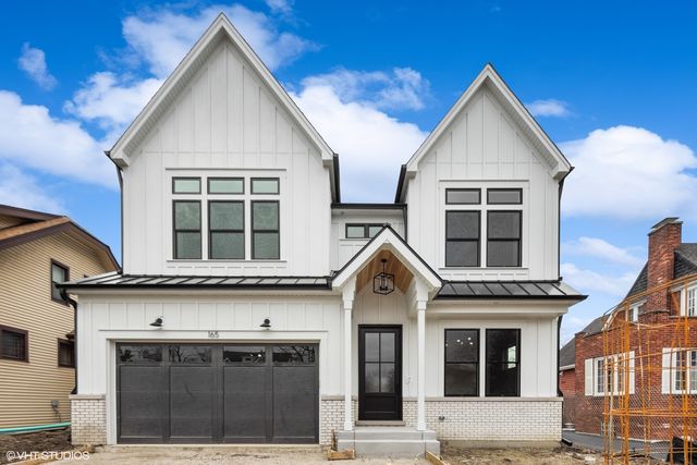 a view of a house with large windows