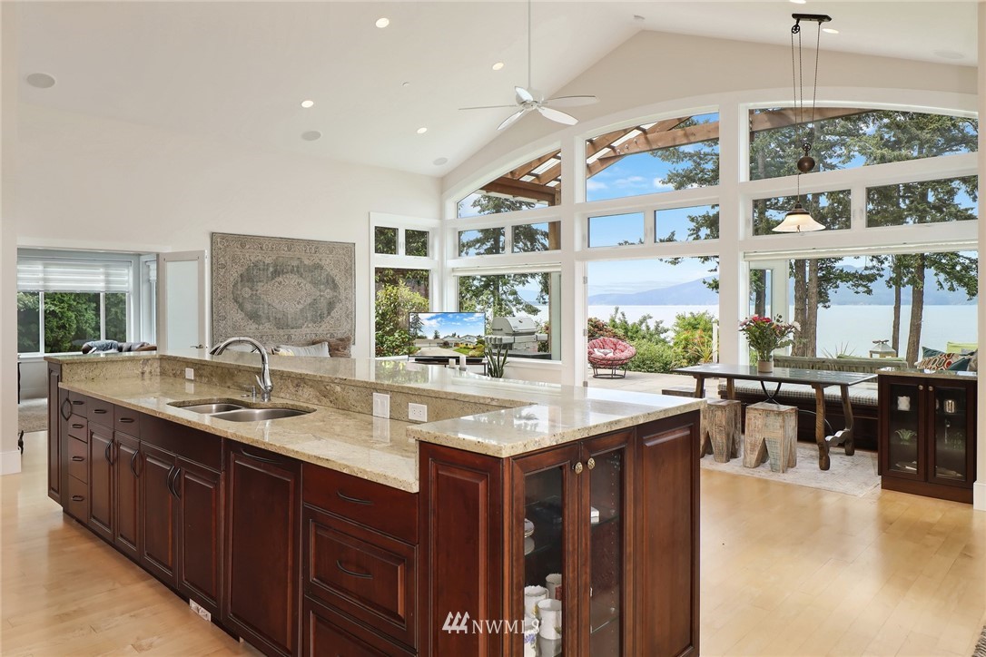 530 Bayside Road Bellingham, WA 98225 - Photo 11 of 40 a kitchen with center island with sink and a large window