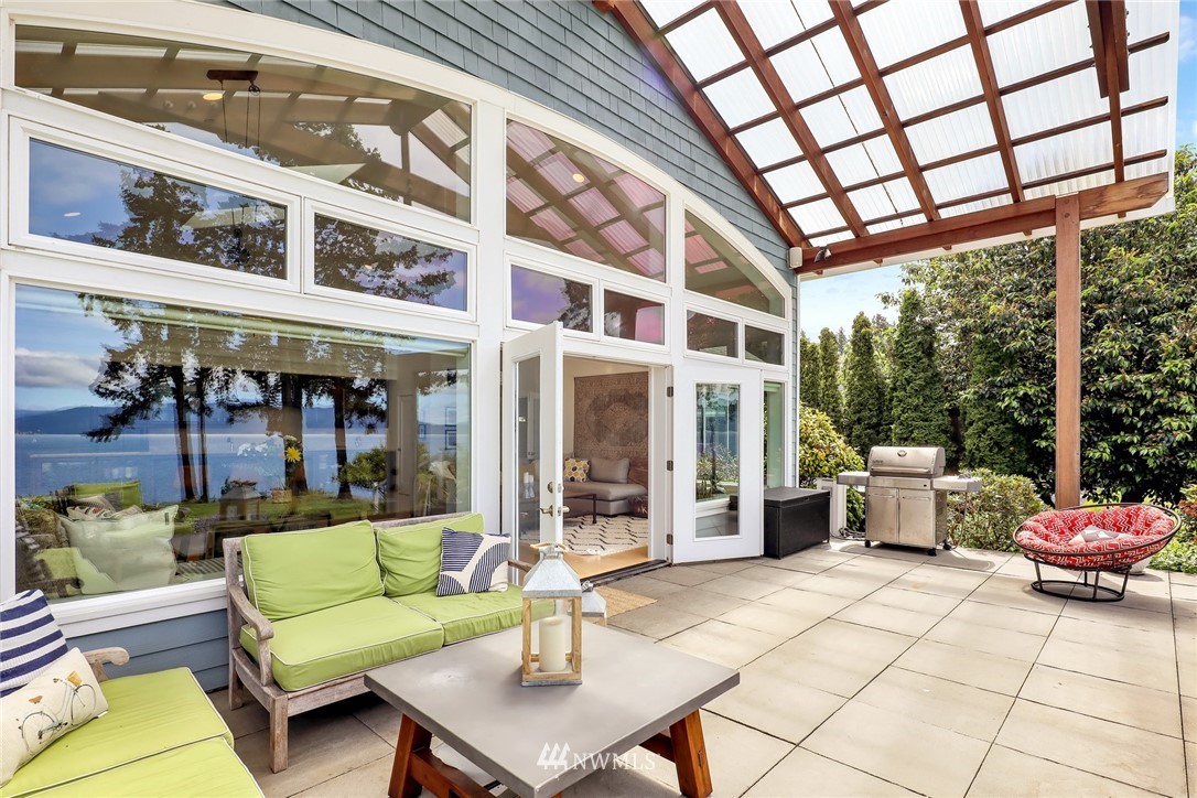 530 Bayside Road Bellingham, WA 98225 - Photo 17 of 40 a view of a patio with couches table and chairs and potted plants