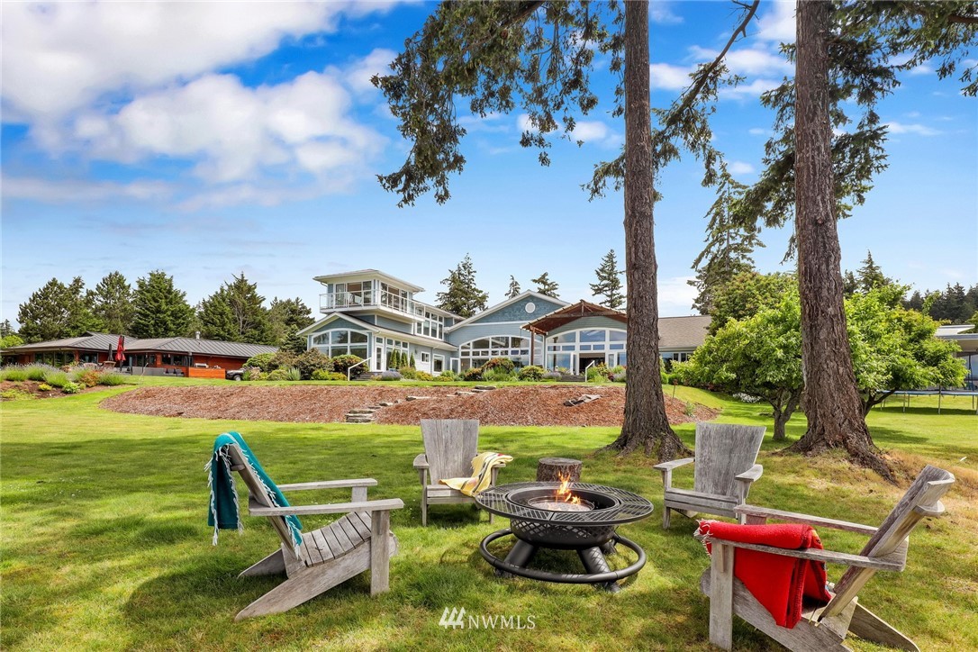 530 Bayside Road Bellingham, WA 98225 - Photo 20 of 40 a view of a swimming pool with lawn chairs and a fire pit