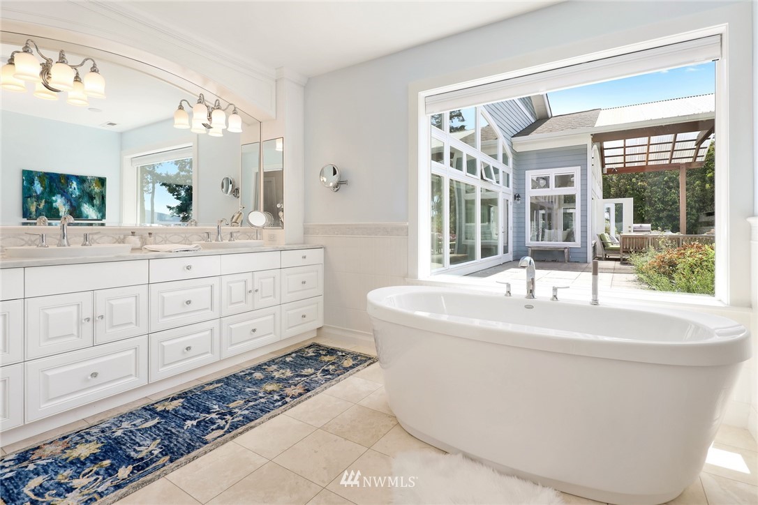 530 Bayside Road Bellingham, WA 98225 - Photo 23 of 40 a spacious bathroom with sink shower and mirror