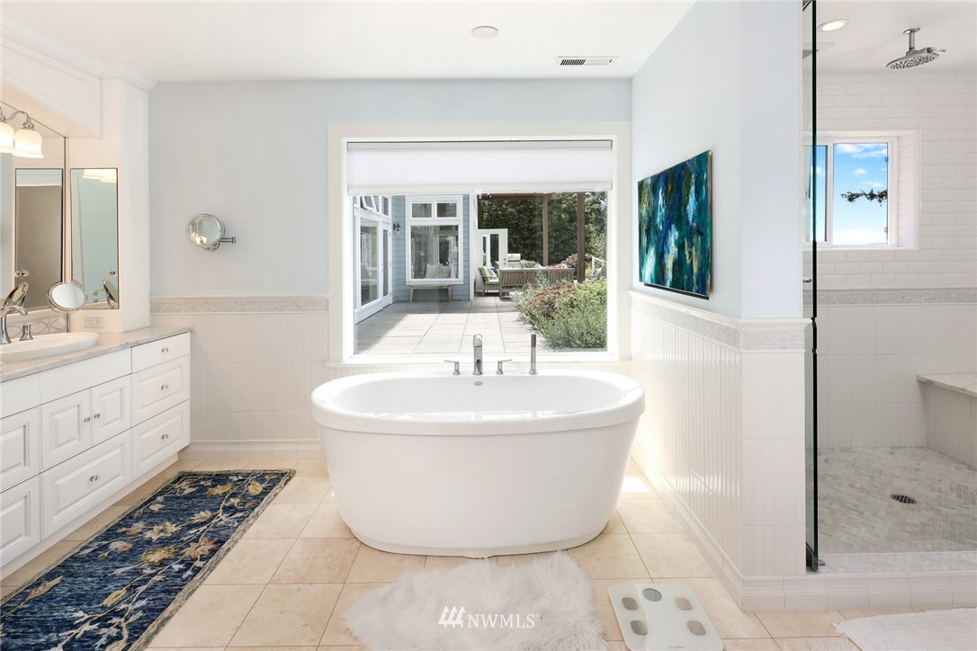 530 Bayside Road Bellingham, WA 98225 - Photo 24 of 40 a bathroom with a sink a mirror and a shower