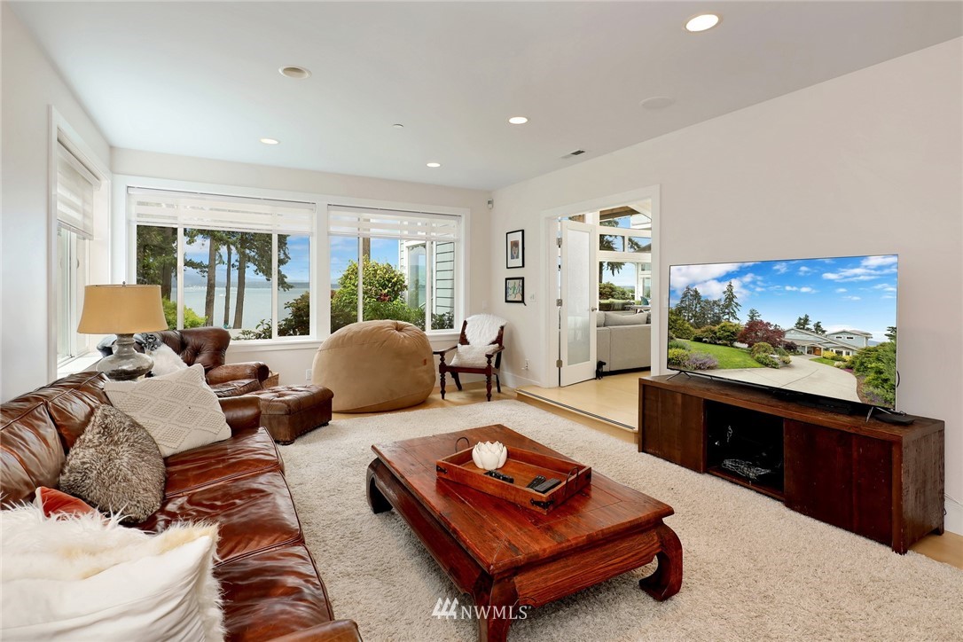530 Bayside Road Bellingham, WA 98225 - Photo 28 of 40 a living room with furniture and a flat screen tv