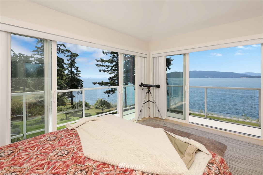 530 Bayside Road Bellingham, WA 98225 - Photo 31 of 40 a bedroom with a bed and a large window