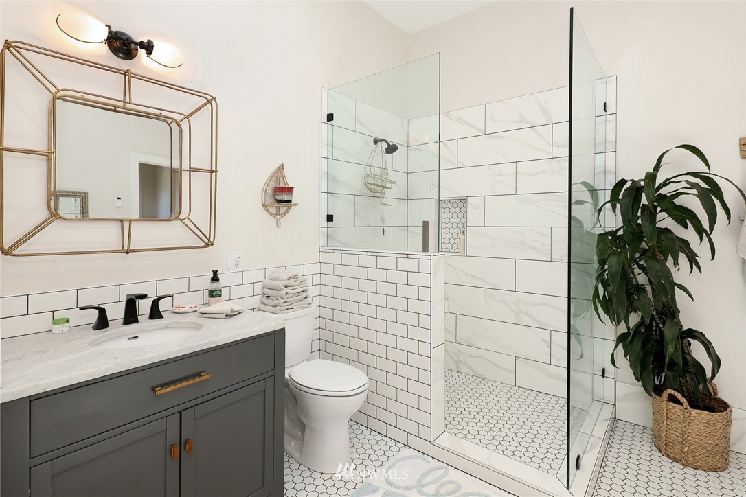 530 Bayside Road Bellingham, WA 98225 - Photo 34 of 40 a bathroom with a sink a toilet and shower