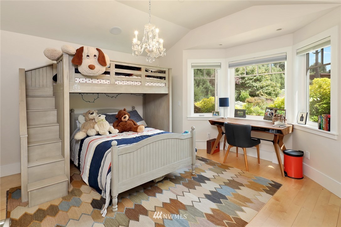 530 Bayside Road Bellingham, WA 98225 - Photo 35 of 40 a bed room with a bed and a chandelier