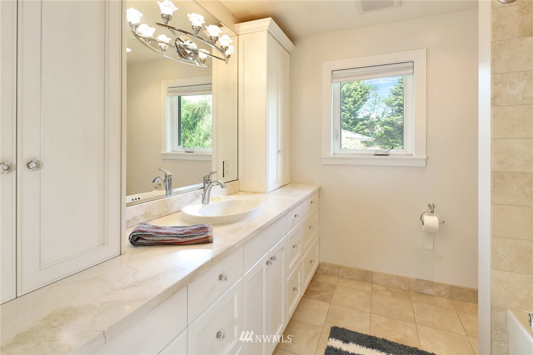 530 Bayside Road Bellingham, WA 98225 - Photo 37 of 40 a bathroom with a sink a vanity and a mirror
