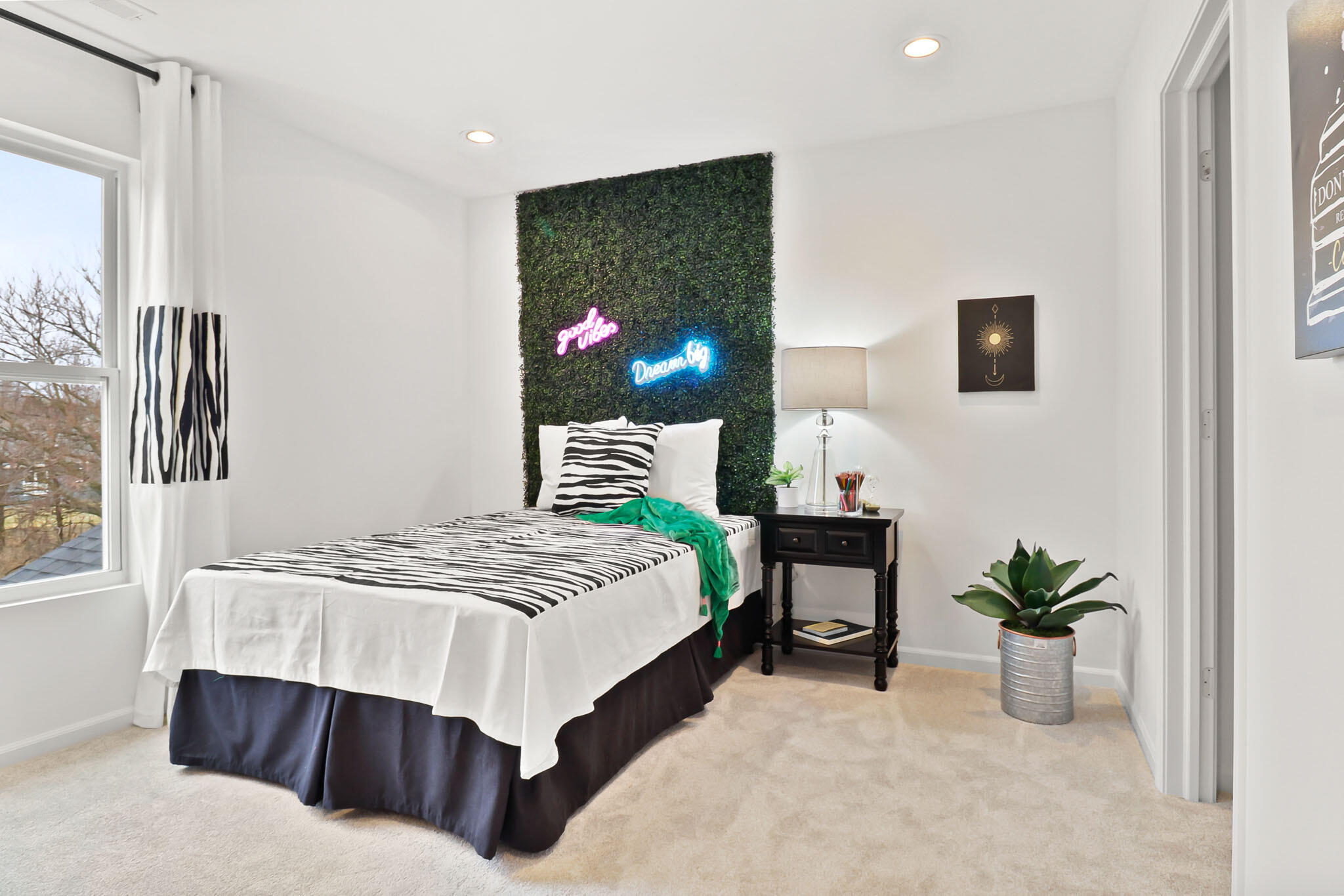 6786 East 104th Avenue Winfield, IN 46307 - Photo 14 of 21 a bedroom with a bed and a potted plant