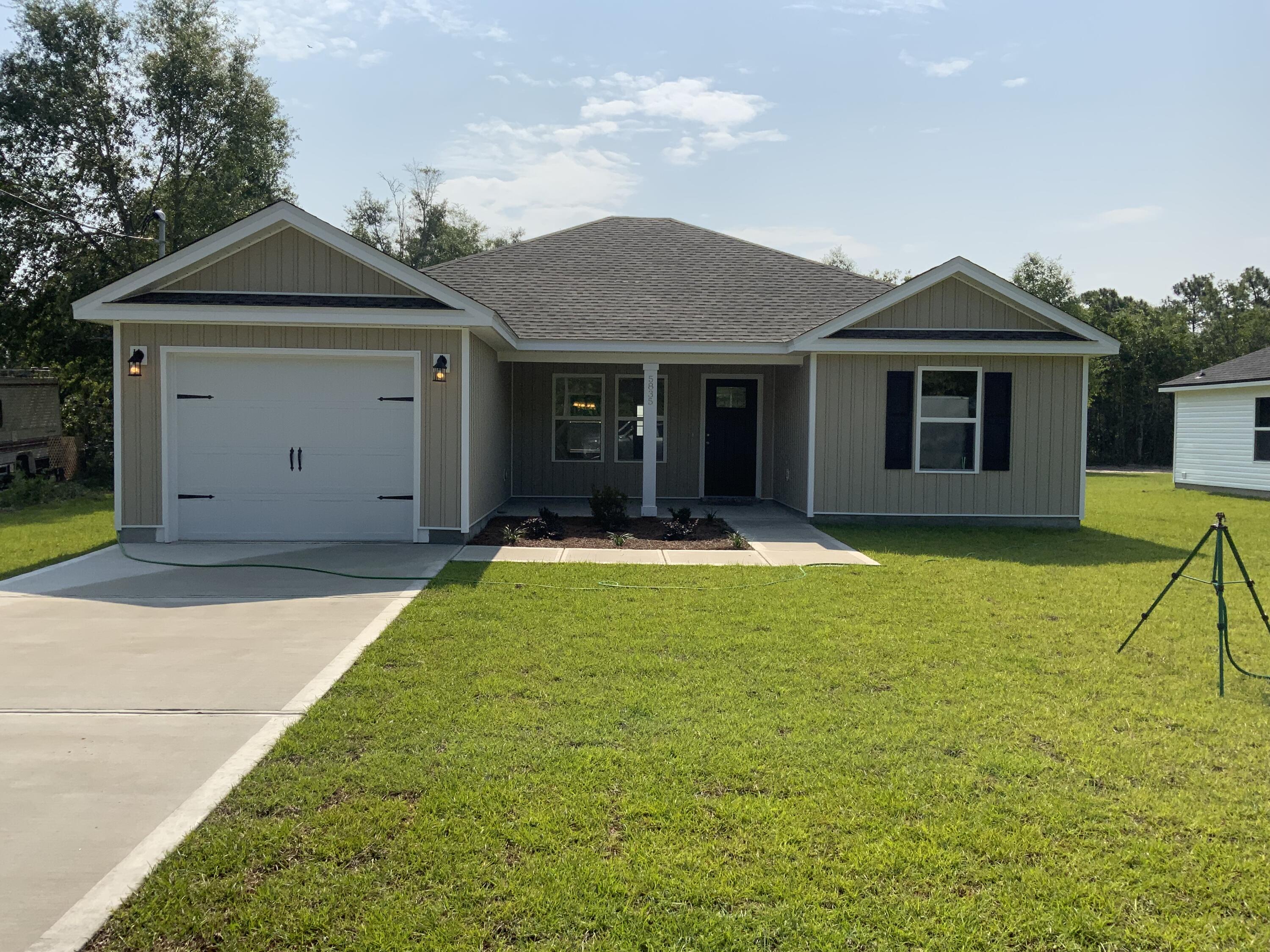 5835 Flamingo Road Crestview, FL 32539 - Photo 1 of 12 a view of an house with backyard space and balcony