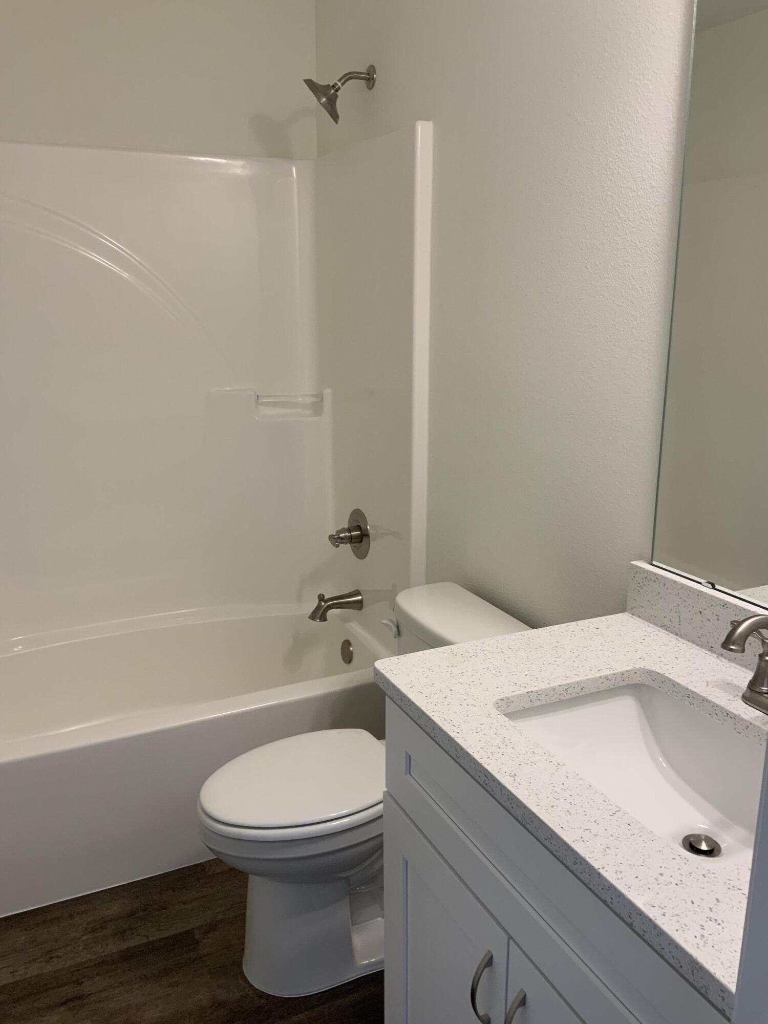 5835 Flamingo Road Crestview, FL 32539 - Photo 10 of 12 a bathroom with a sink a toilet and shower