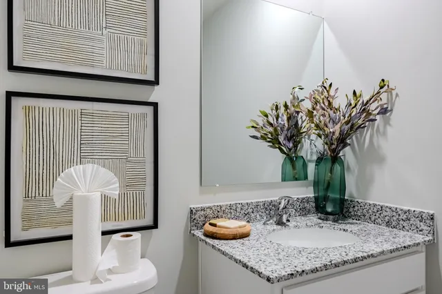 a view of a lake with a big yard with wooden fence