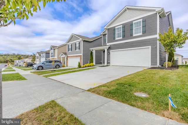 a view of a dining room with furniture and a window