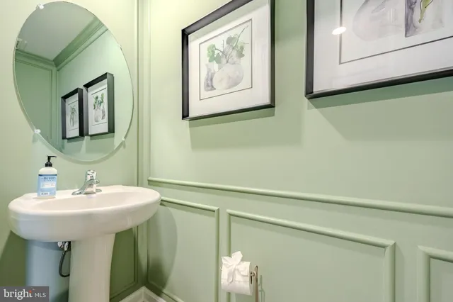 a brick house with a yard in front of it