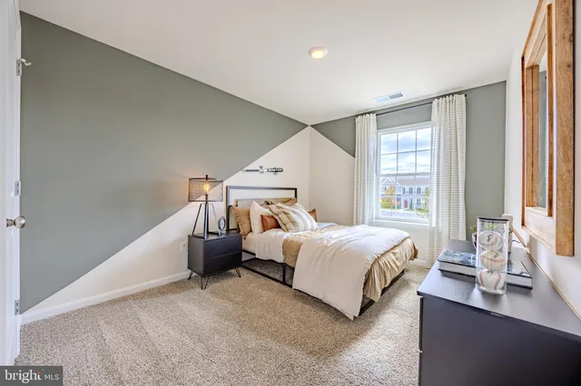 a view of hallway with wooden floor
