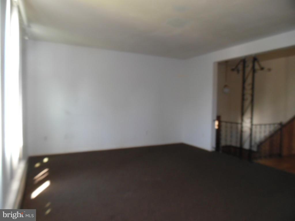6914 German Hill Road Baltimore, MD 21222 - Photo 2 of 28 wooden floor in an empty room
