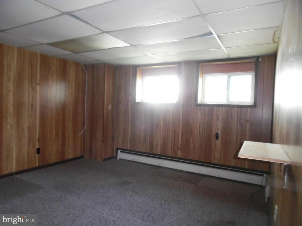 6914 German Hill Road Baltimore, MD 21222 - Photo 17 of 28 an empty room with windows
