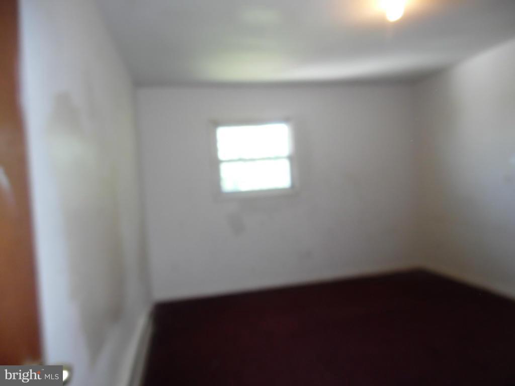 6914 German Hill Road Baltimore, MD 21222 - Photo 21 of 28 an empty room with a window