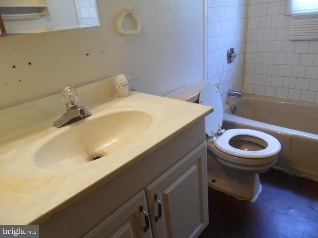 6914 German Hill Road Baltimore, MD 21222 - Photo 25 of 28 a bathroom with a sink and toilet