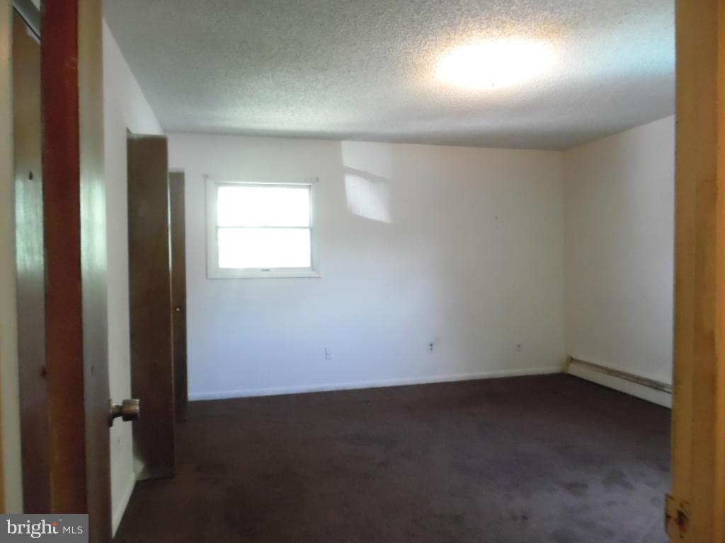 6914 German Hill Road Baltimore, MD 21222 - Photo 28 of 28 an empty room with a window