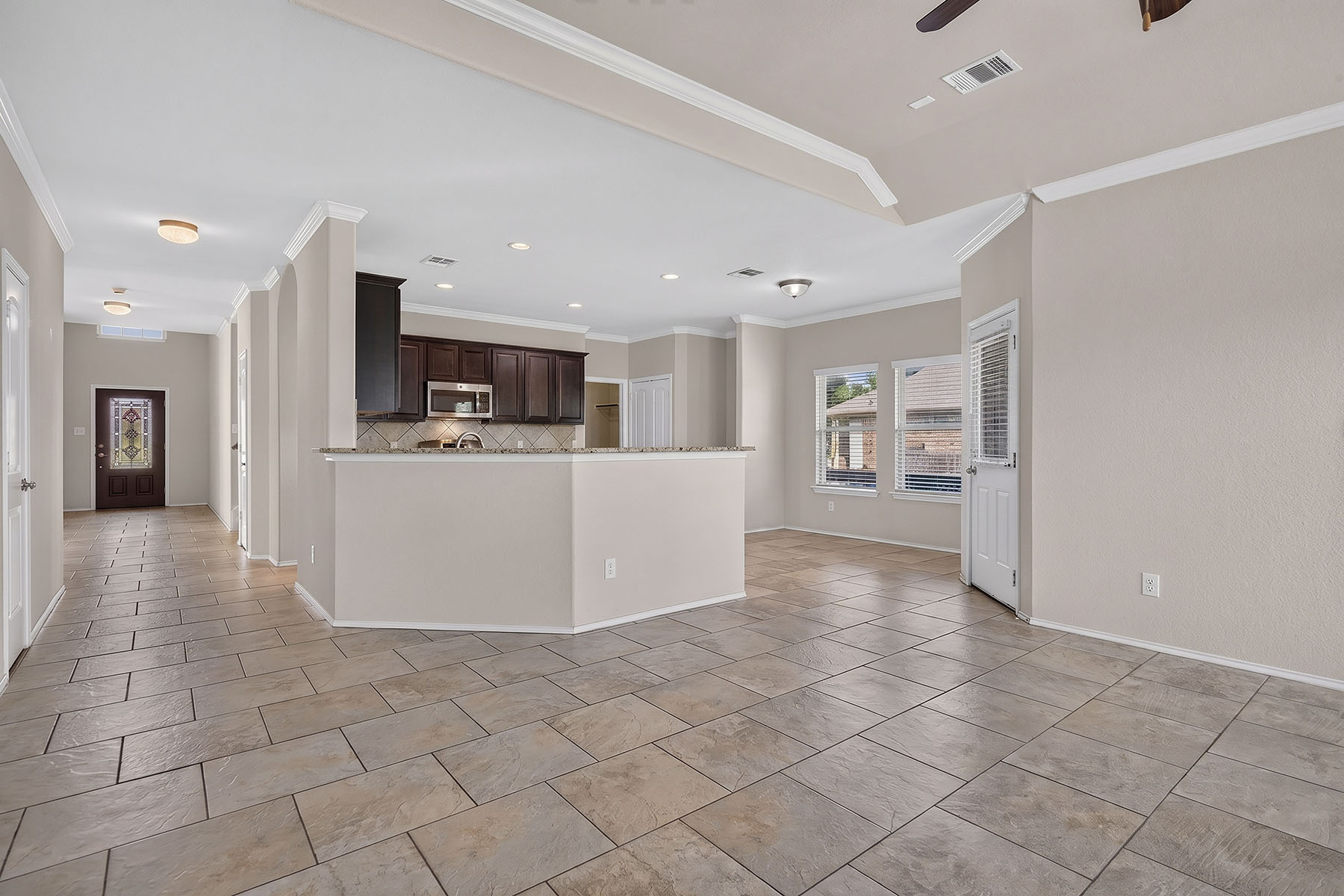 4601 Chestnut Meadows Bend Georgetown, TX 78626 - Photo 12 of 35 An open concept design seamlessly connects the kitchen to the spacious living area, ideal for gatherings.