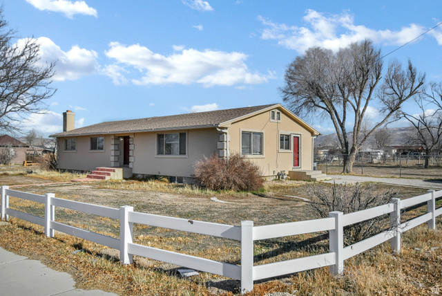 10 North Main Street Centerfield, UT 84622 - Photo 1 of 52 Single story home featuring a fenced front yard, stucco siding, and a chimney