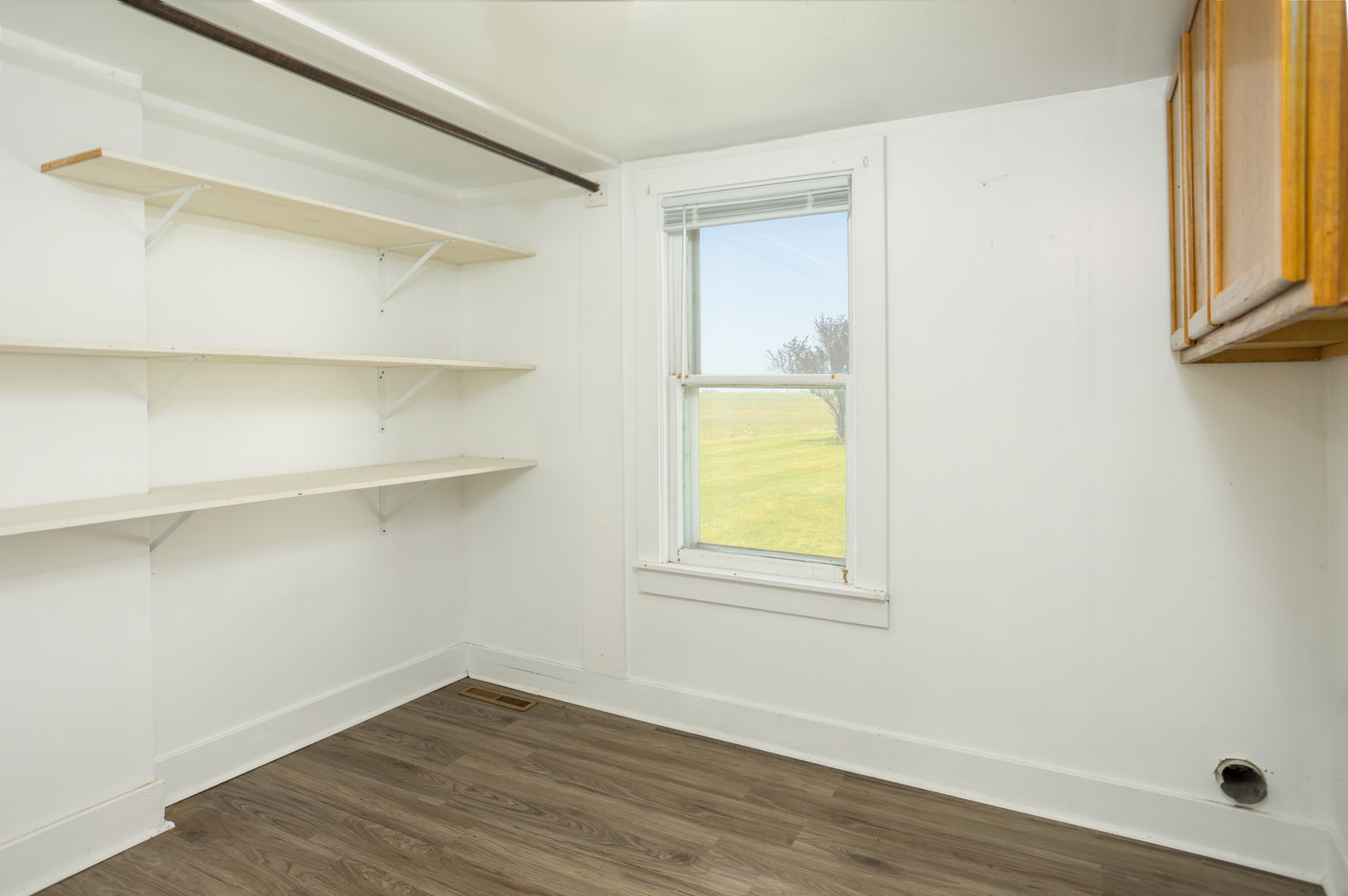 670 East 2300 North Road Danforth, IL 60930 - Photo 18 of 34 a view of an empty room with wooden floor and a window