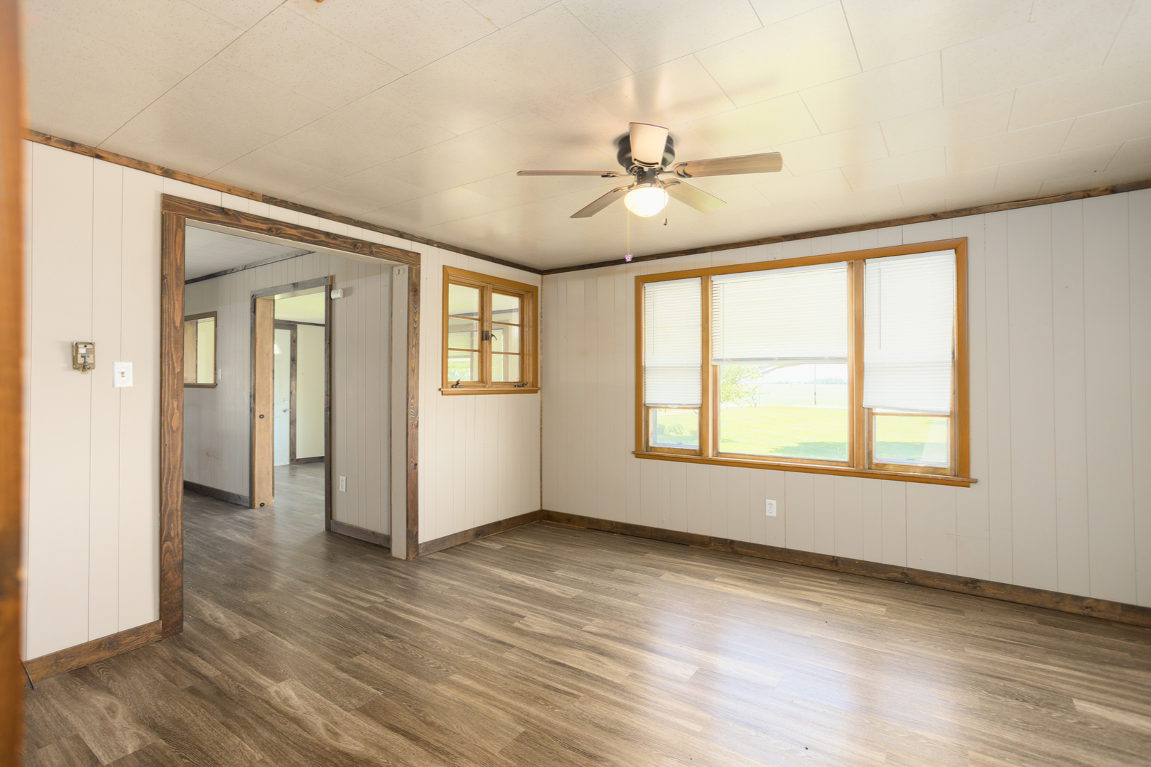 670 East 2300 North Road Danforth, IL 60930 - Photo 23 of 34 a view of an empty room with a window and wooden floor