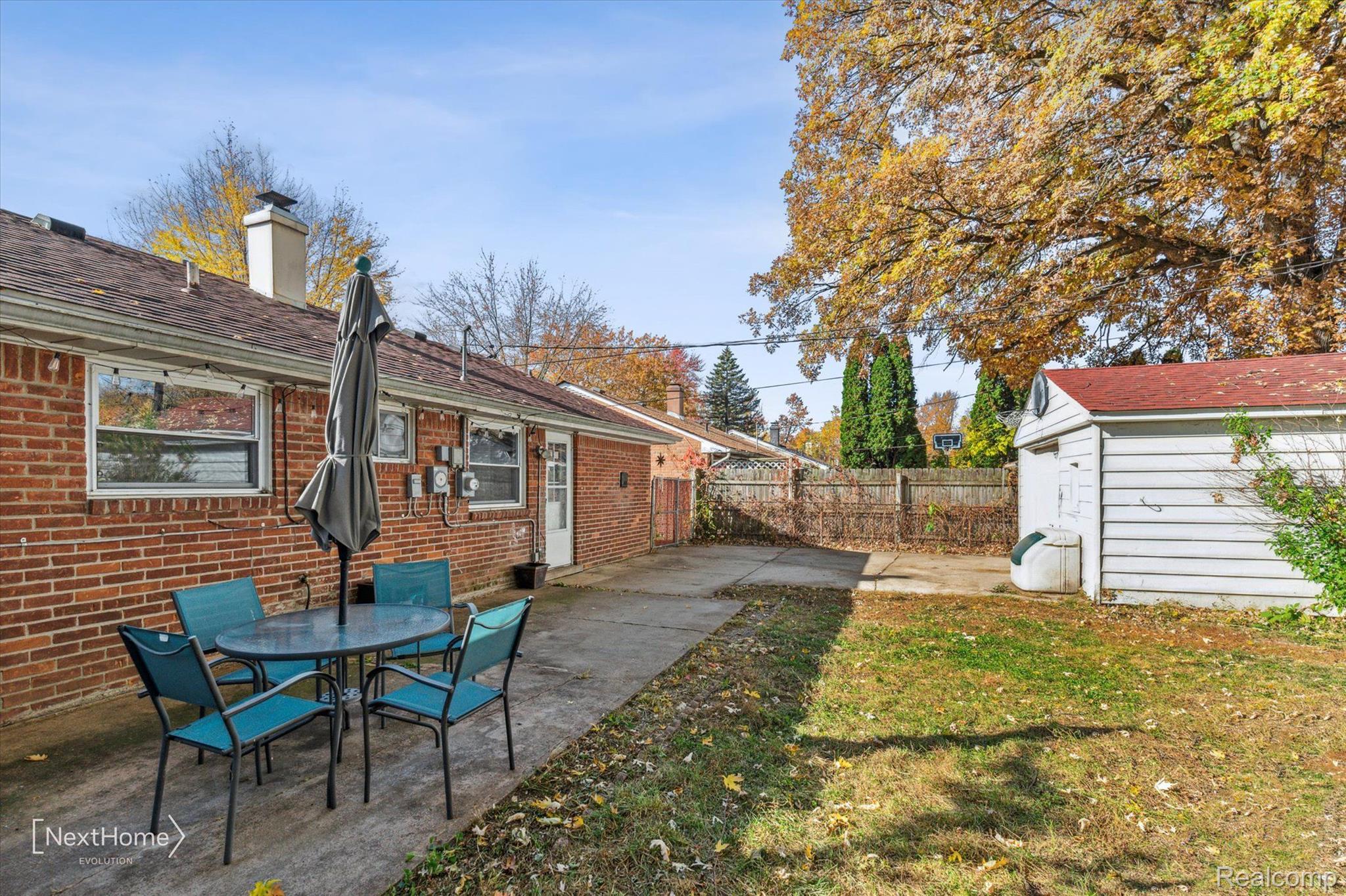 20902 Wick Road Taylor, MI 48180 - Photo 22 of 26 View of fenced back yard and patio area