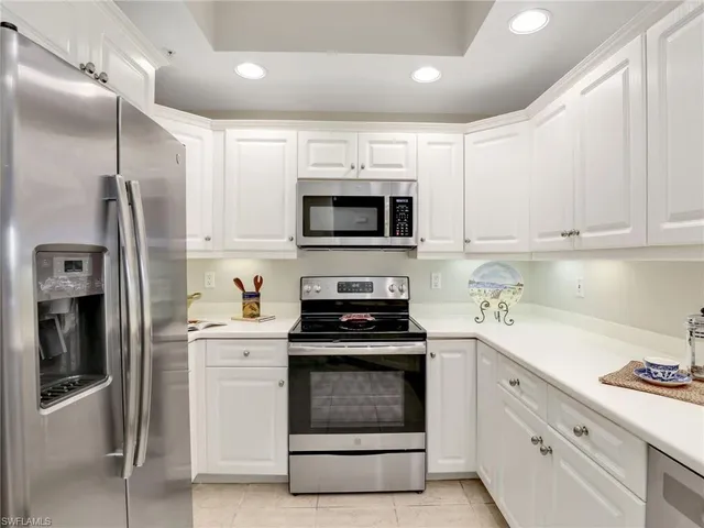 a kitchen with a stove and a refrigerator