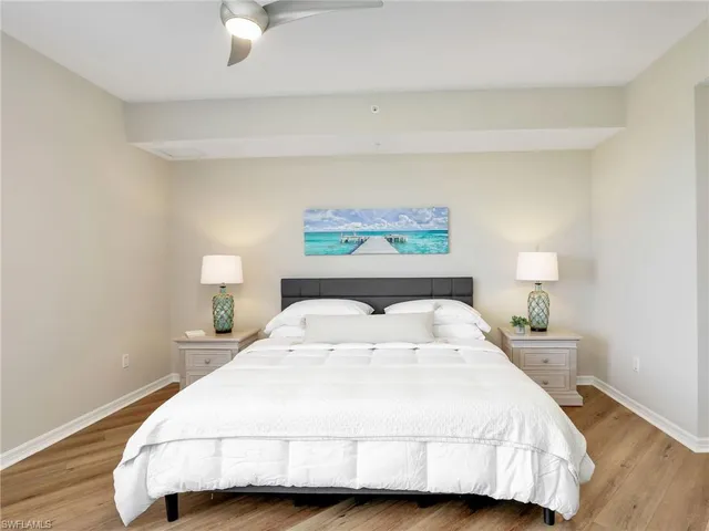 a bedroom with a bed and a night lamp