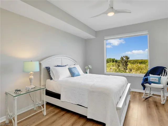 a bedroom with a bed and a chair