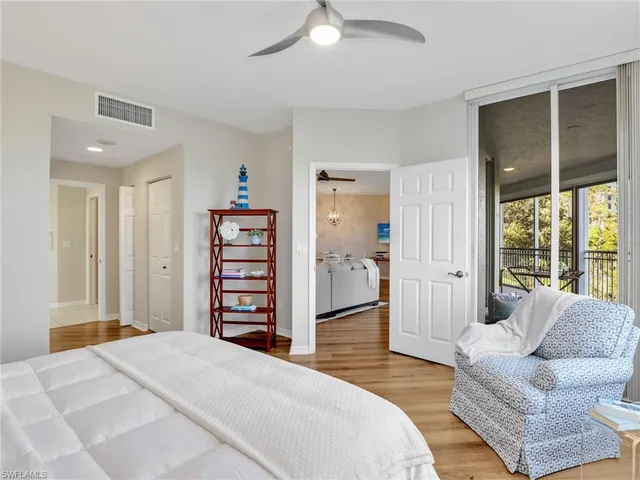 a spacious bedroom with a bed and a couch