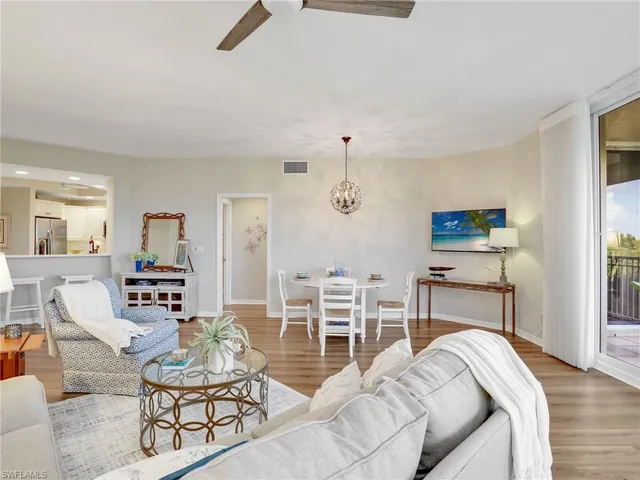 a spacious bedroom with a bed and furniture