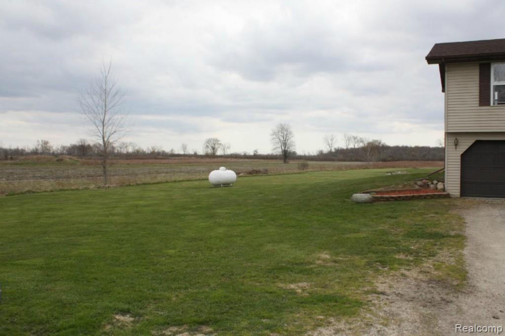 11725 Rynn Road Emmett, MI 48022 - Photo 29 of 33 propane tank - east side of yard