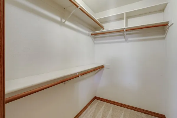 a bathroom with a bathtub and a window
