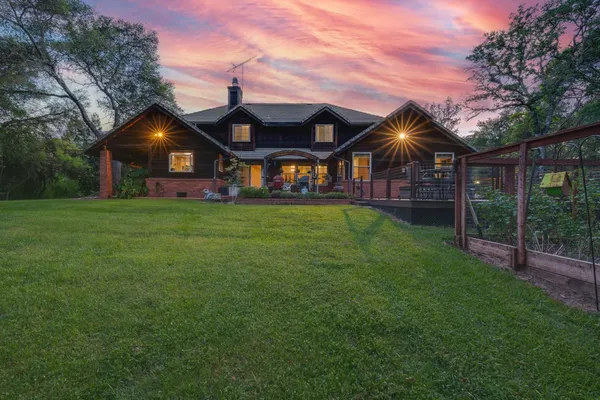 a front view of house with yard and green space