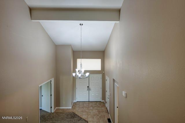2640 Rockview Drive Reno, NV 89519 - Photo 33 of 56 a view of a hallway with wooden floor and chandelier