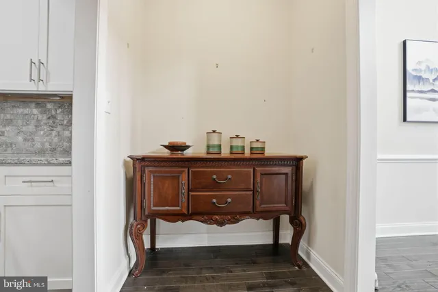 a view of bedroom with furniture and wooden floor