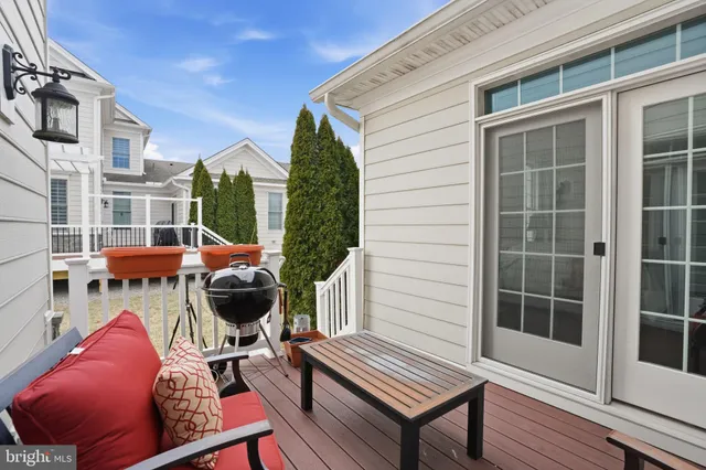 a view of a chairs and table in the patio of a house