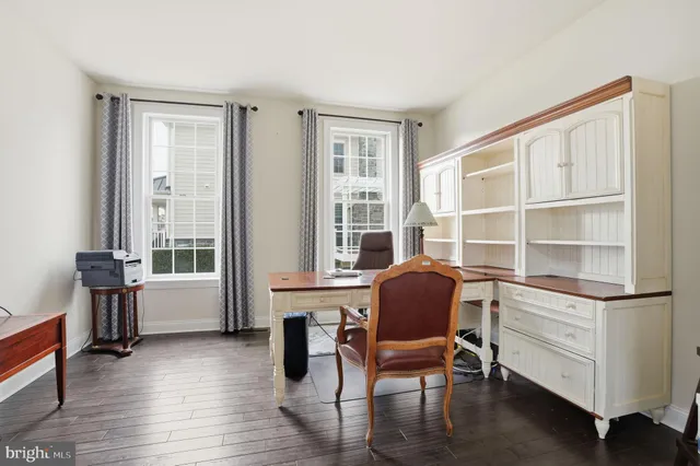 a work room with furniture and a window