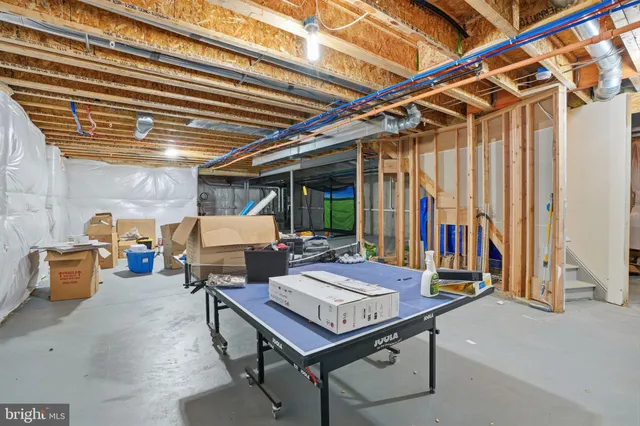 a view of a patio with a table and chairs and couches