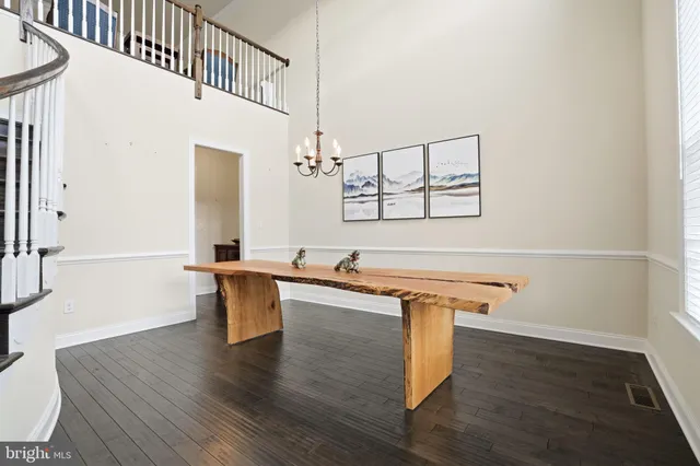 a kitchen with a sink cabinets and wooden floor