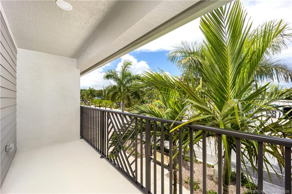 3375 Southwest Mapp Road, Unit 203 Palm City, FL 34990 - Photo 17 of 22 a view of a balcony with plant
