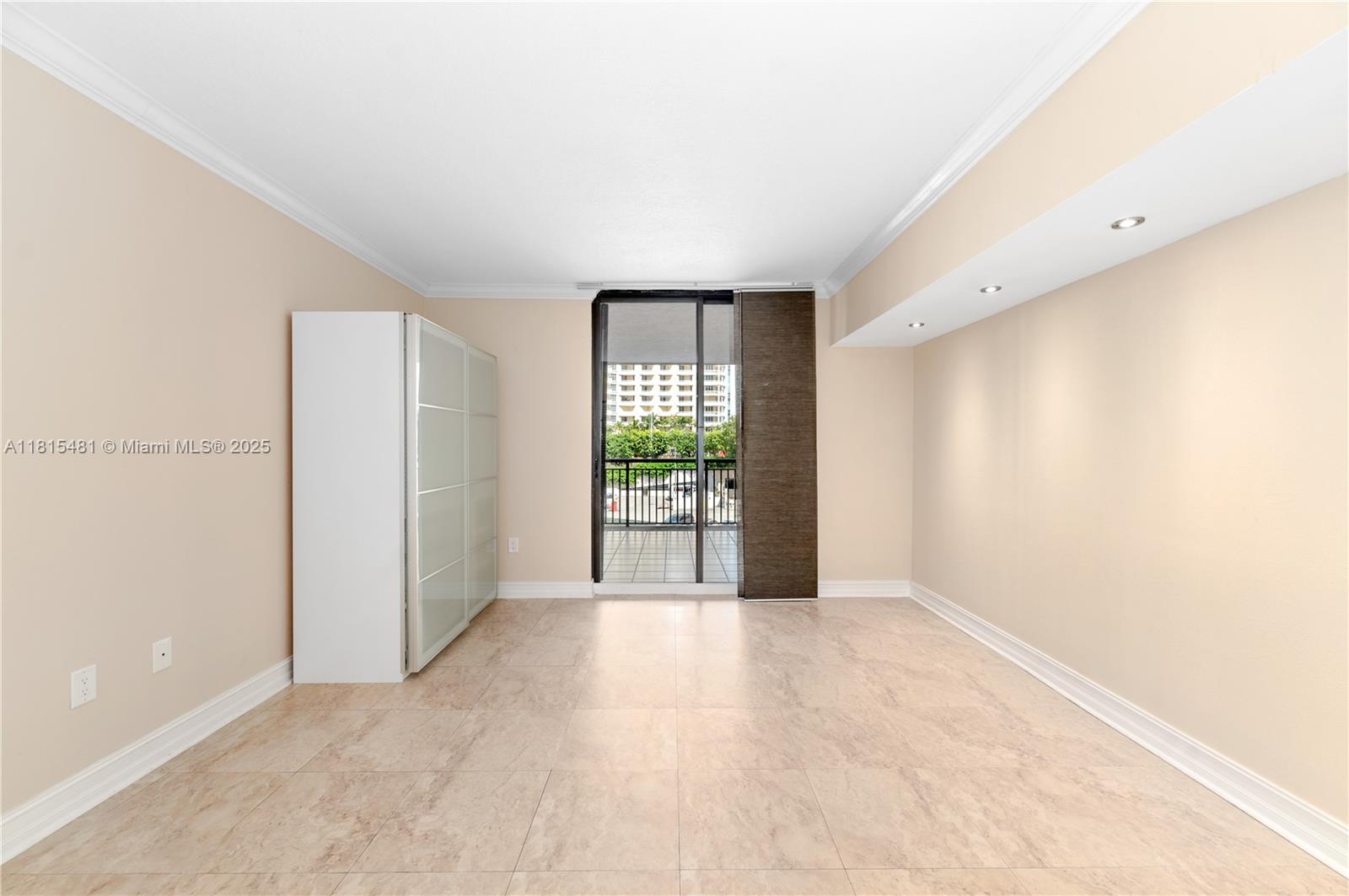 540 Brickell Key Drive, Unit 600 Miami, FL 33131 - Photo 11 of 28 a view of a big room with windows and yard