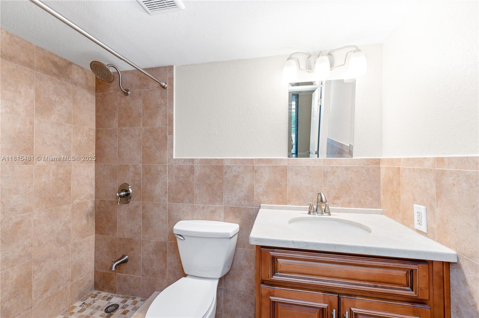540 Brickell Key Drive, Unit 600 Miami, FL 33131 - Photo 13 of 28 a bathroom with a sink toilet and shower