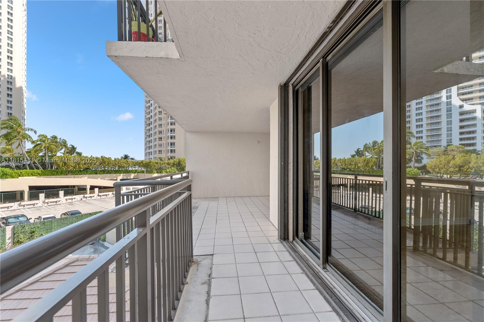 540 Brickell Key Drive, Unit 600 Miami, FL 33131 - Photo 14 of 28 a view of a balcony with wooden floor