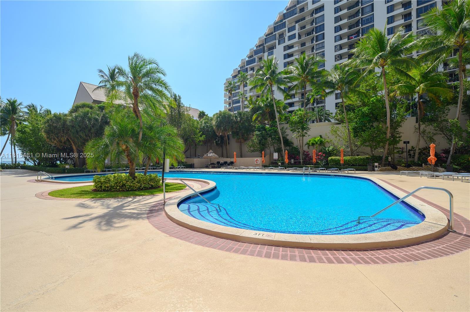 540 Brickell Key Drive, Unit 600 Miami, FL 33131 - Photo 19 of 28 a view of a swimming pool with a yard