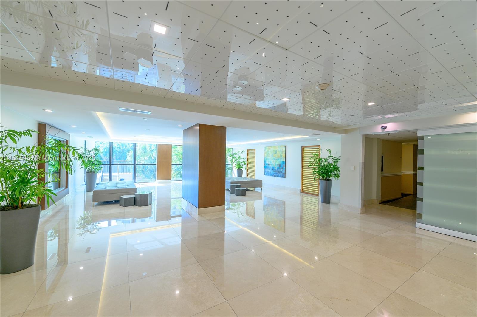 540 Brickell Key Drive, Unit 600 Miami, FL 33131 - Photo 26 of 28 a lobby with furniture and floor to ceiling window